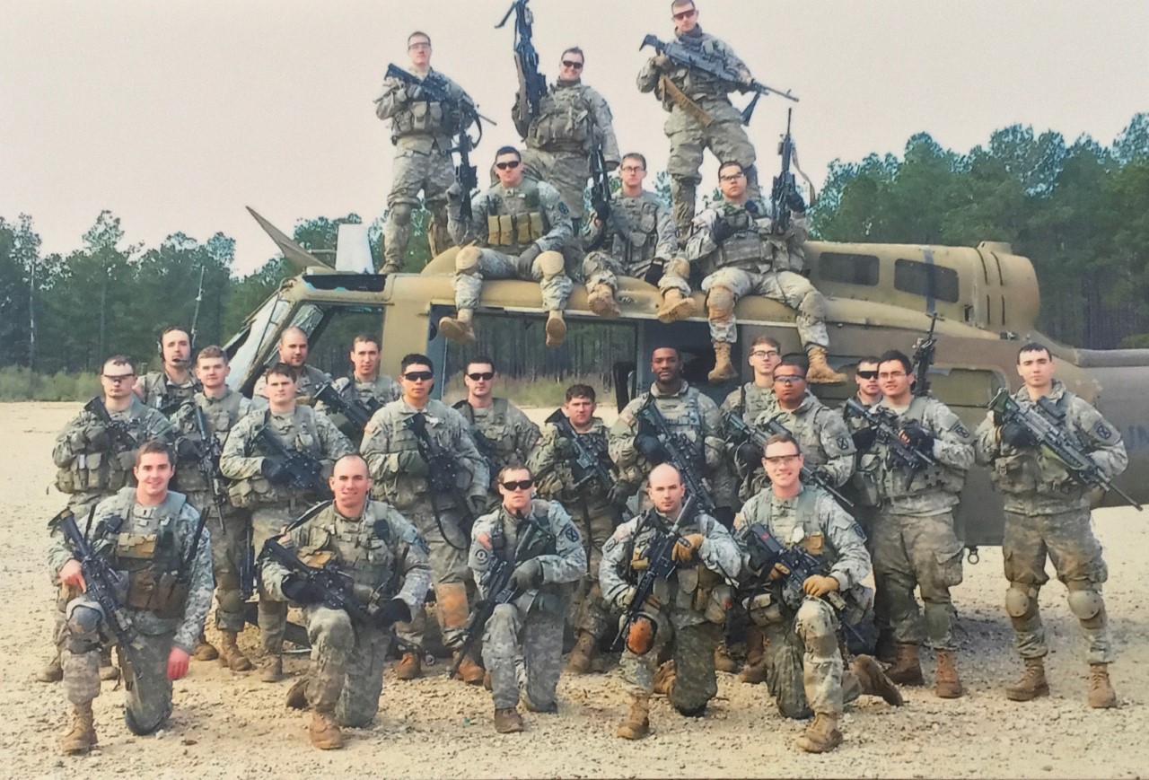 The bald guy in front Squad